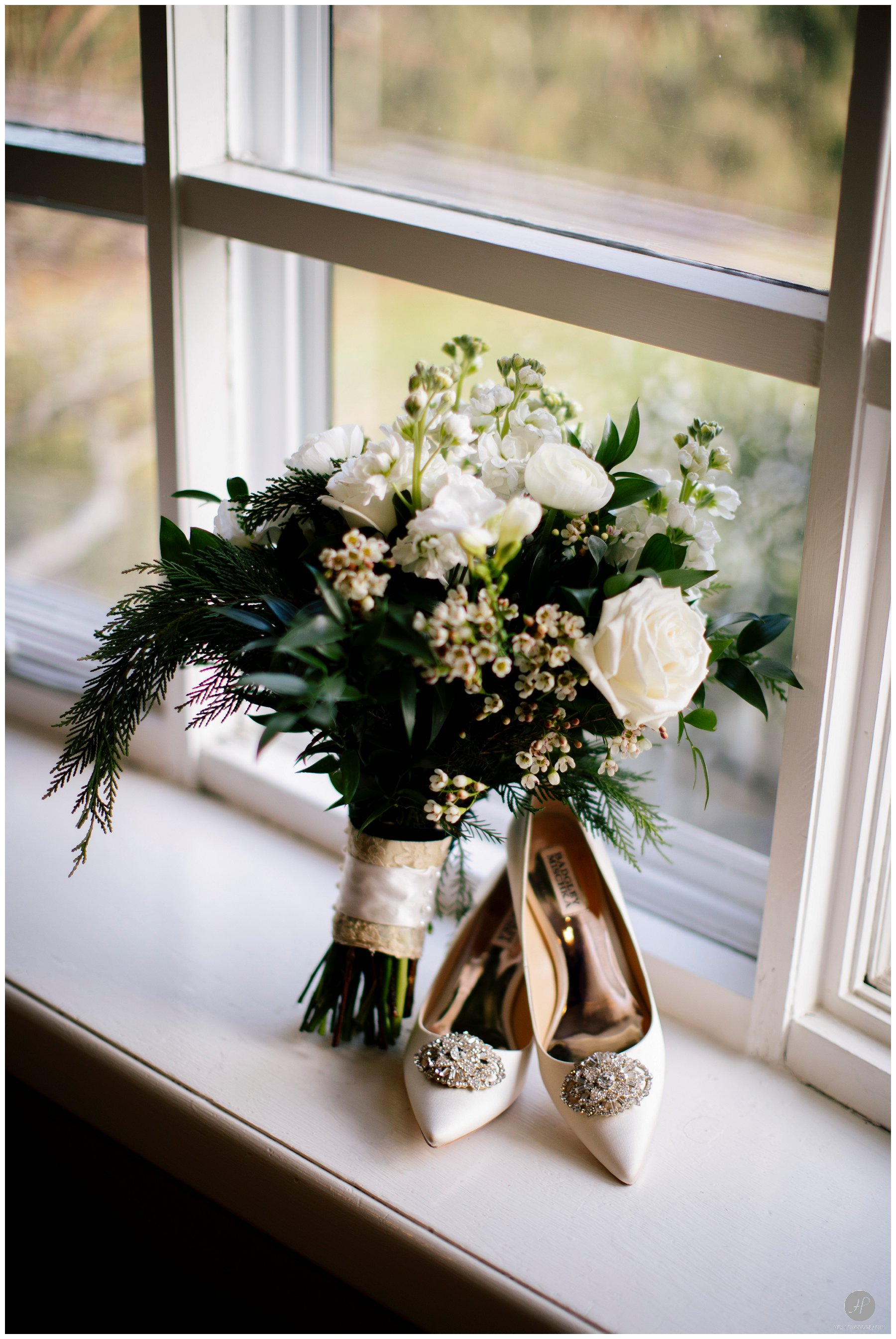brides bouquet and shoes before clarks landing yacht club wedding