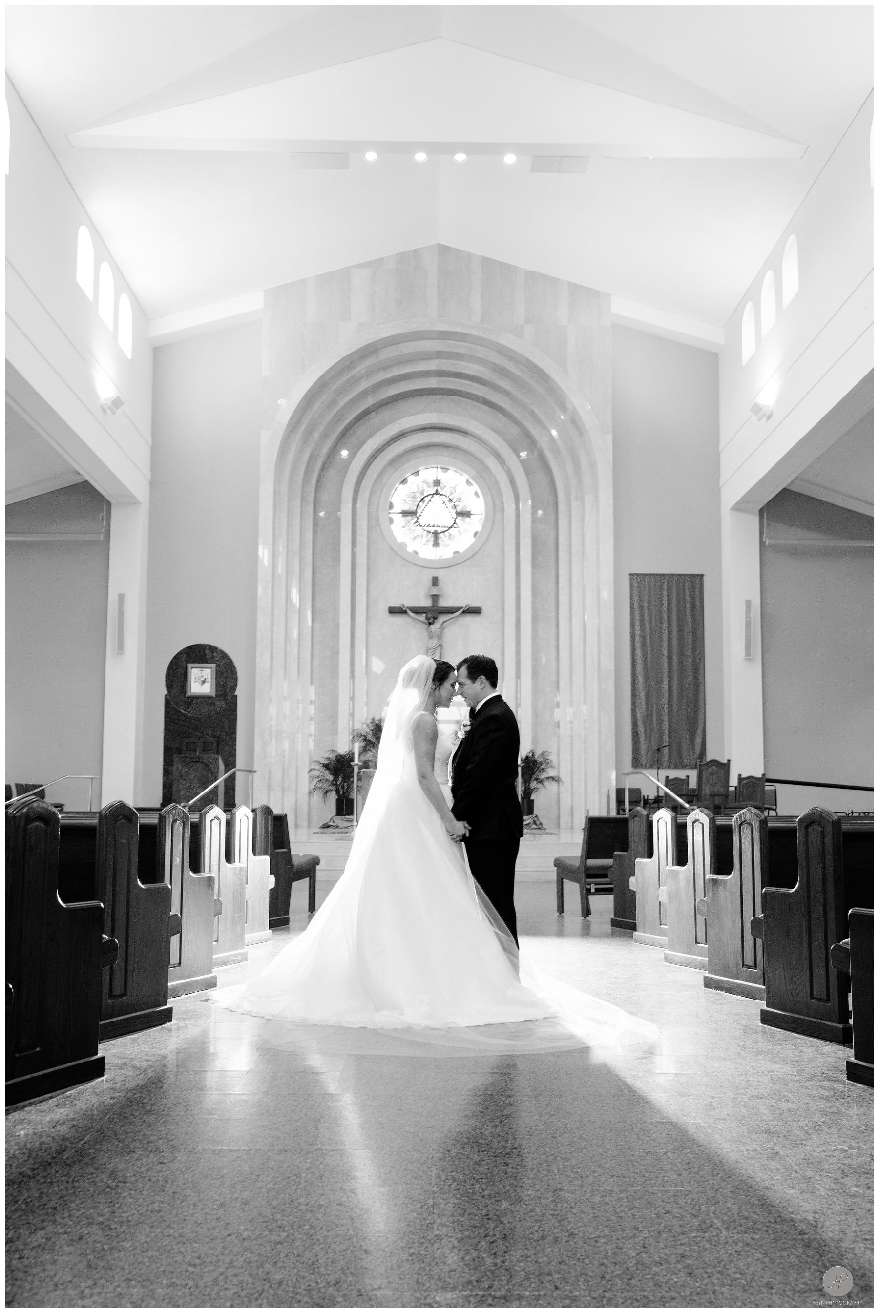 romantic black and white photo of couple in church wedding