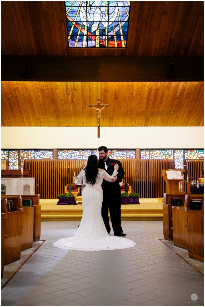 romantic photo of bride and groom in church