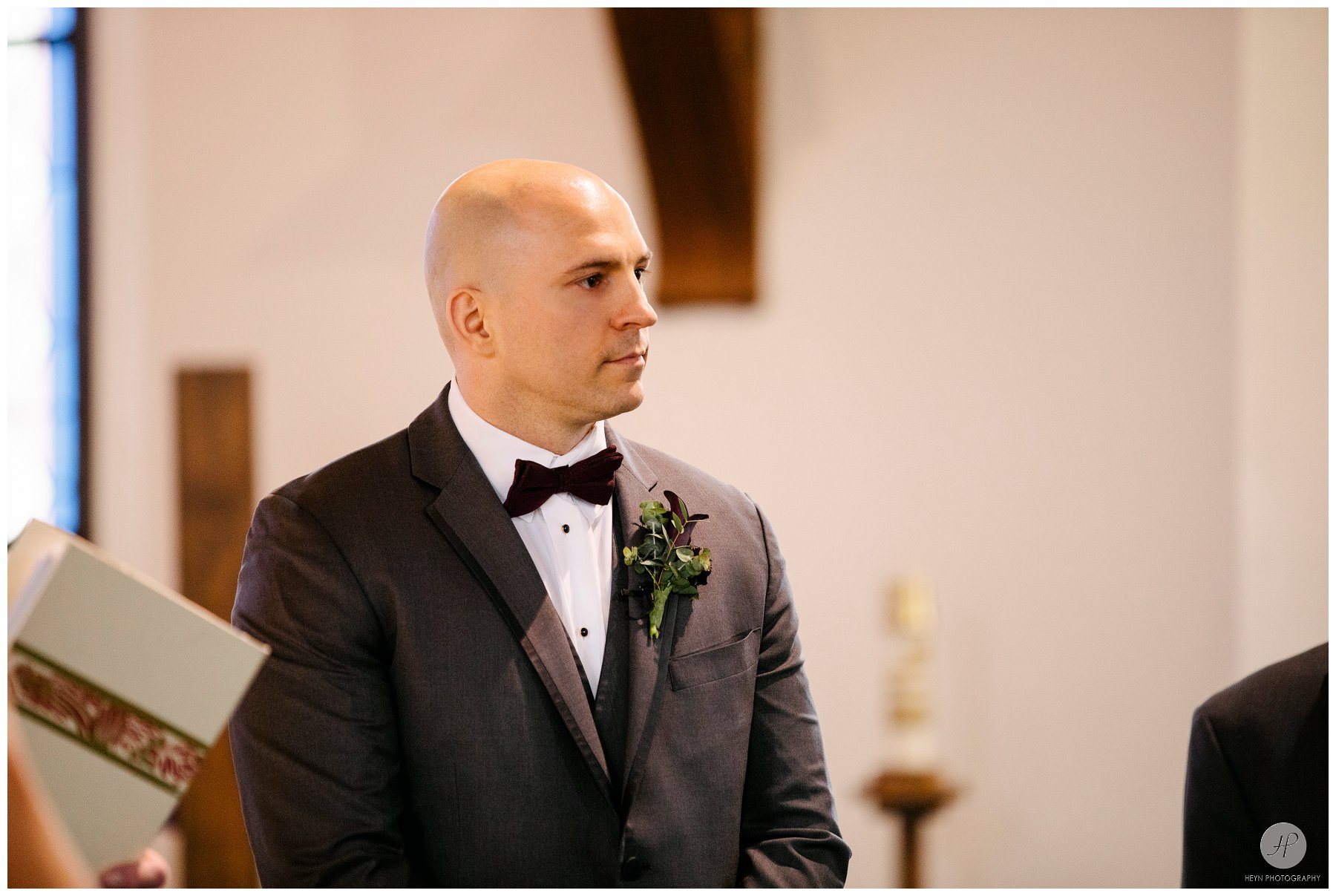 groom waiting at alter