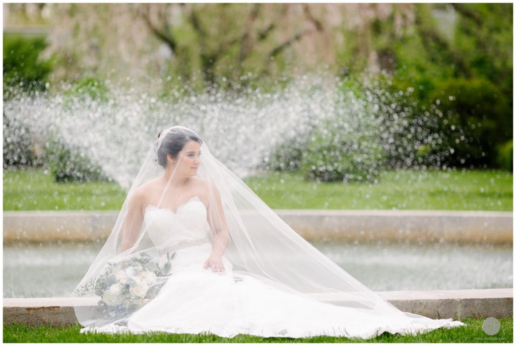 gorgeous outdoor fountain photo of bride