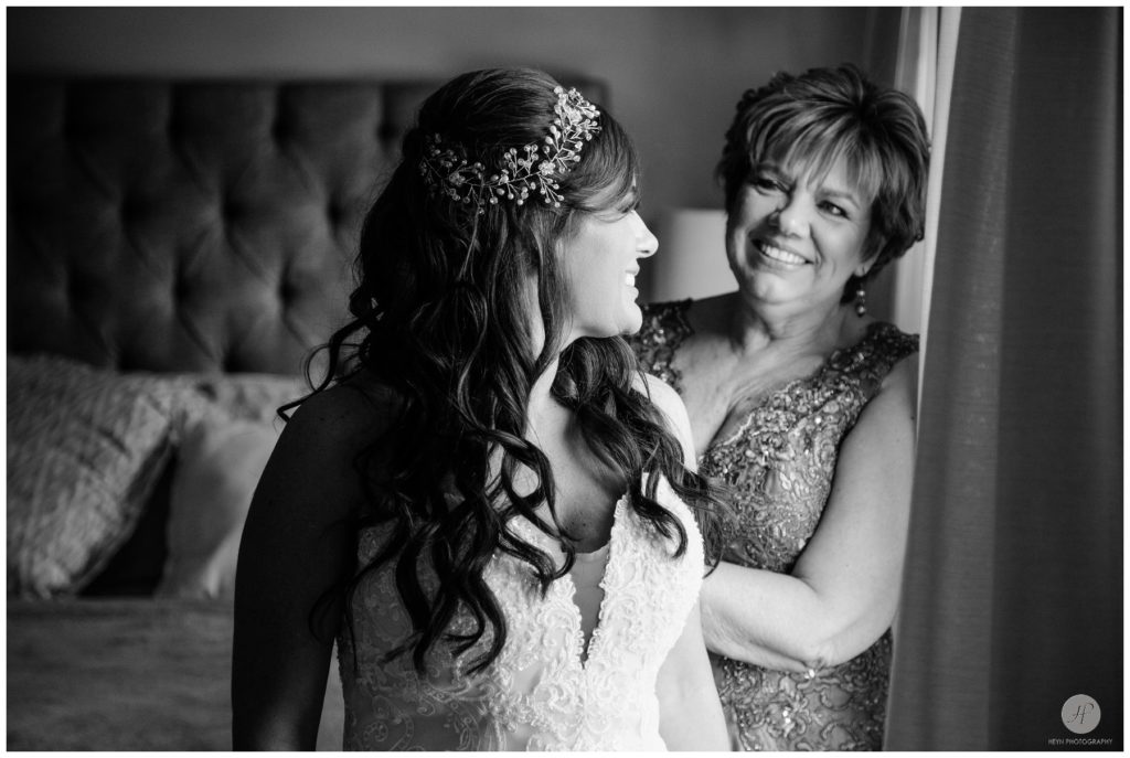 black and white photo of bride and mom getting ready