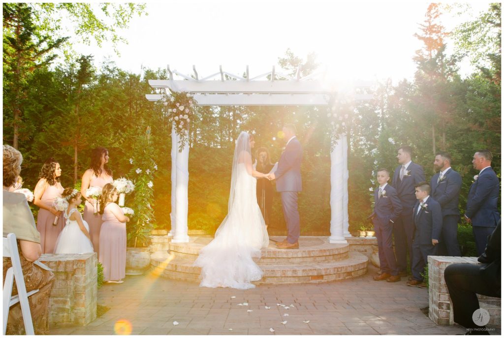 outdoor wedding ceremony at south gate manor