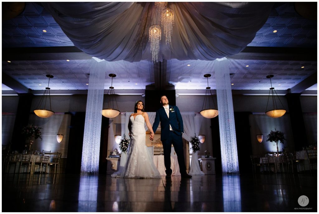 bride and groom in ballroom at south gate manor