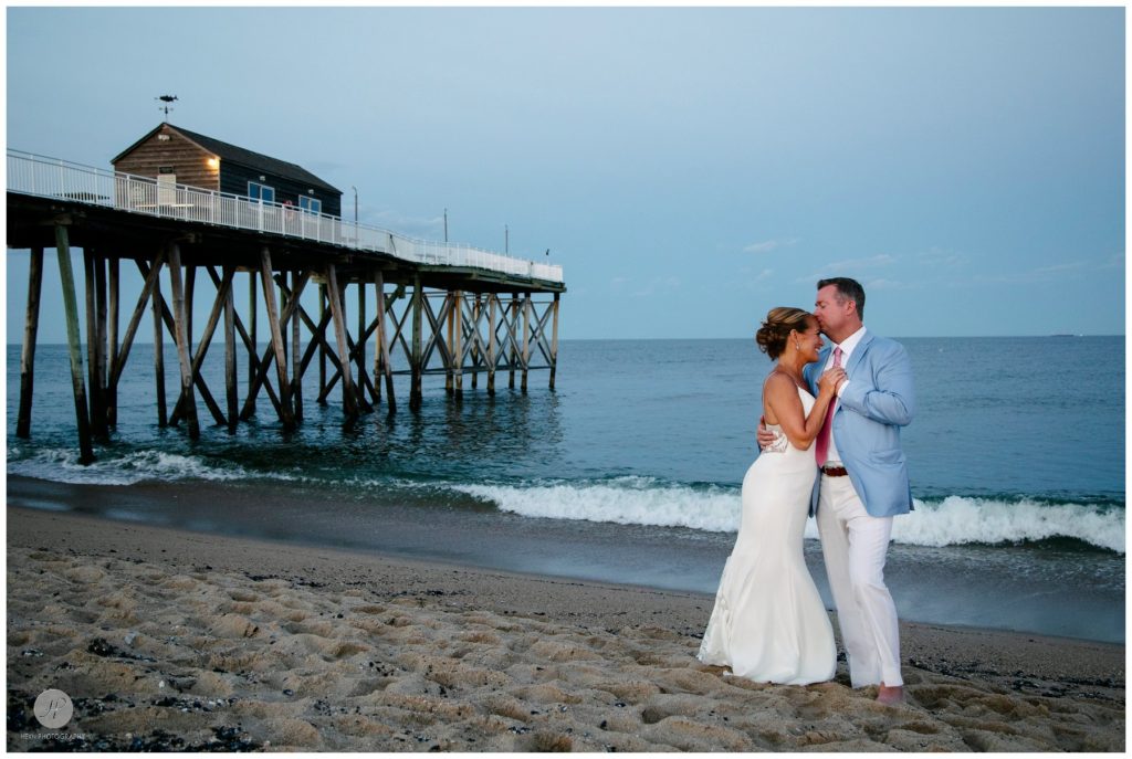 bride and groom romantic sunset photos by pier at belmar fishing club