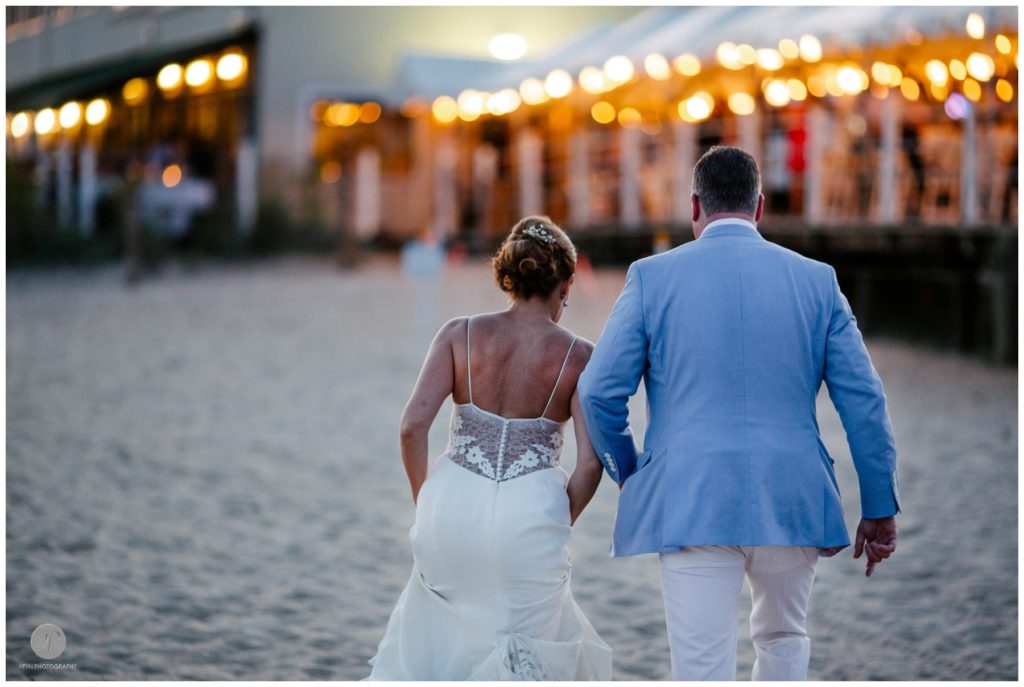 bride and groom on beach at night belmar fishing club