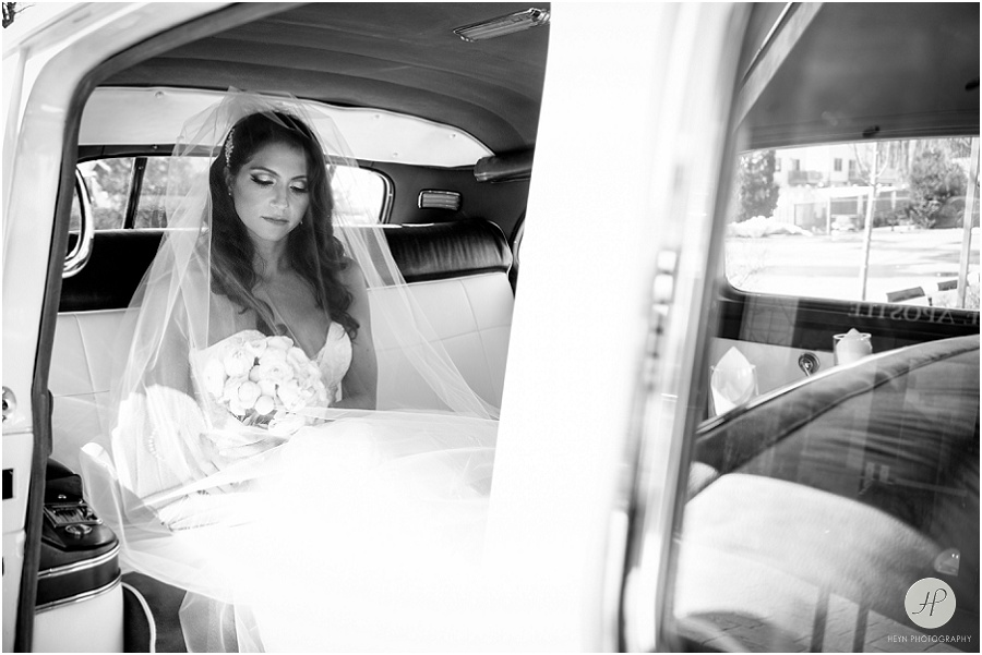 bride waiting in rolls royce before wedding at clarks landing yacht club 