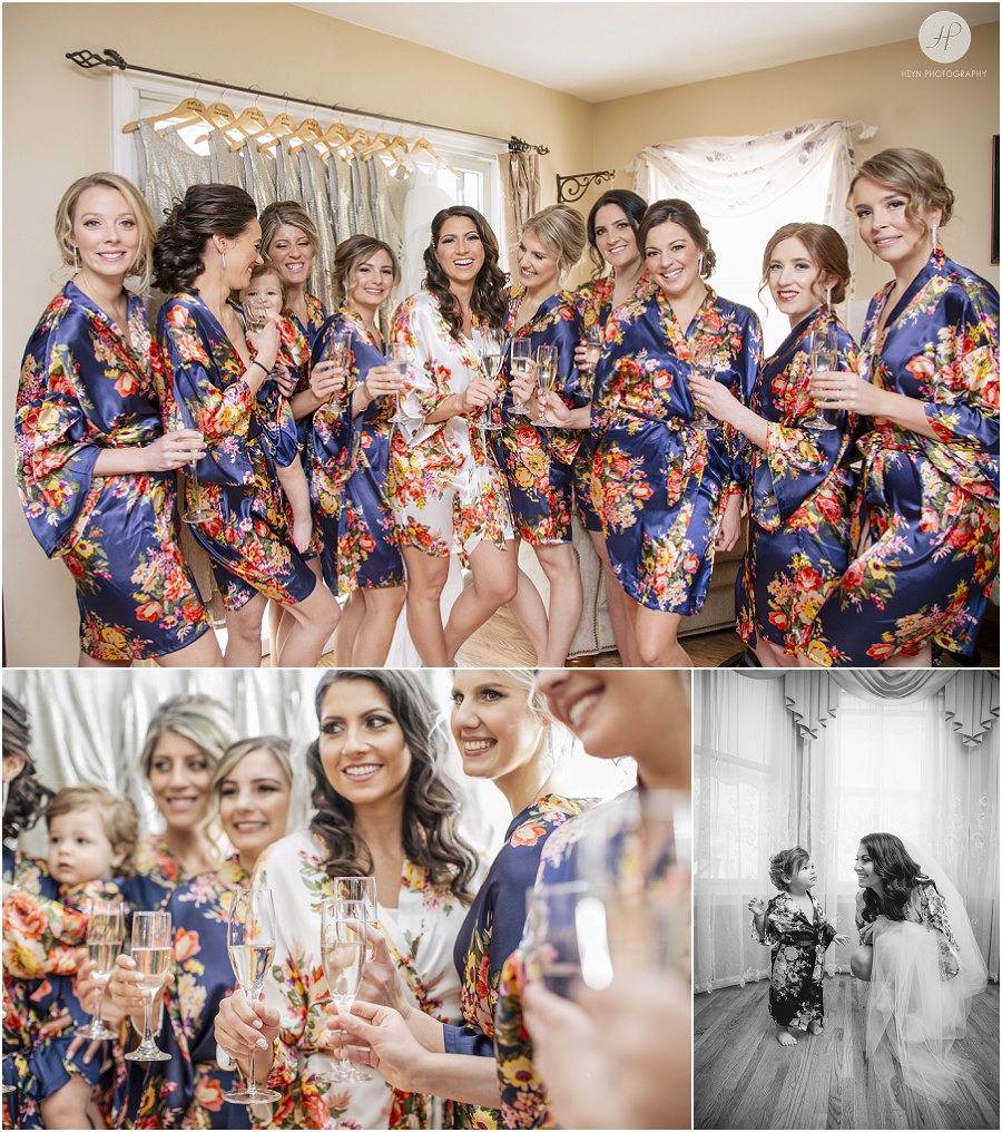 bridesmaids cheers champagne in floral robes 