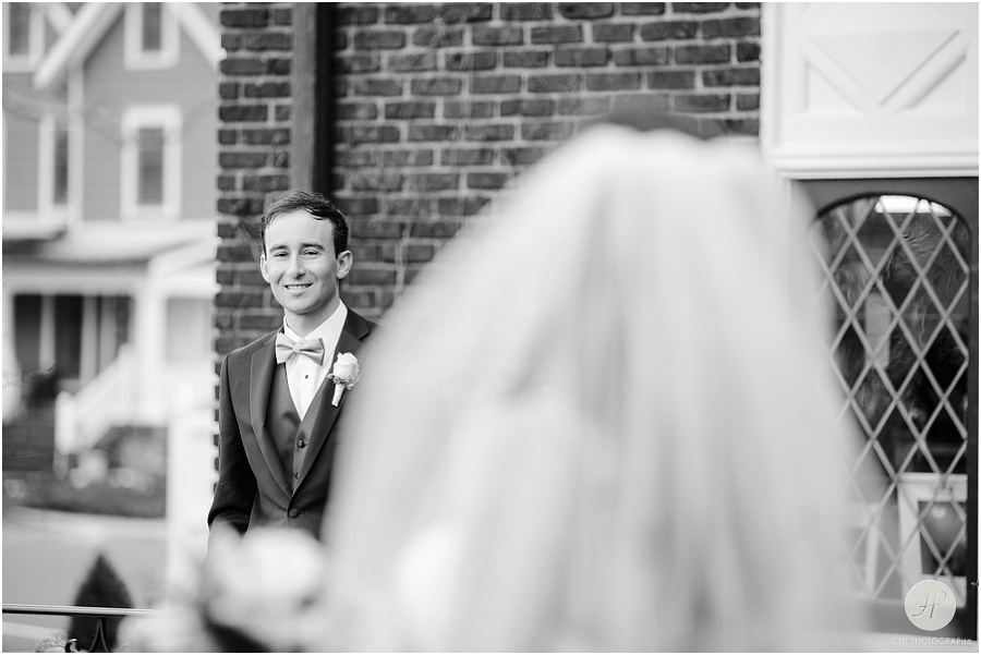 black and white groom looking at bride in spring lake new jersey wedding
