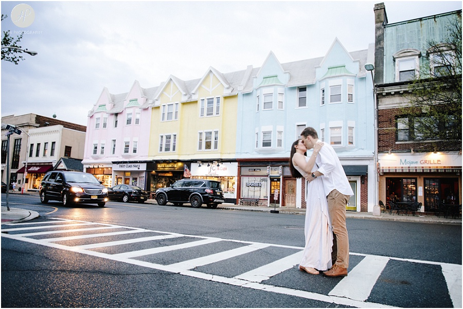 couple kissing in street in downtown westfield engagement session new jersey