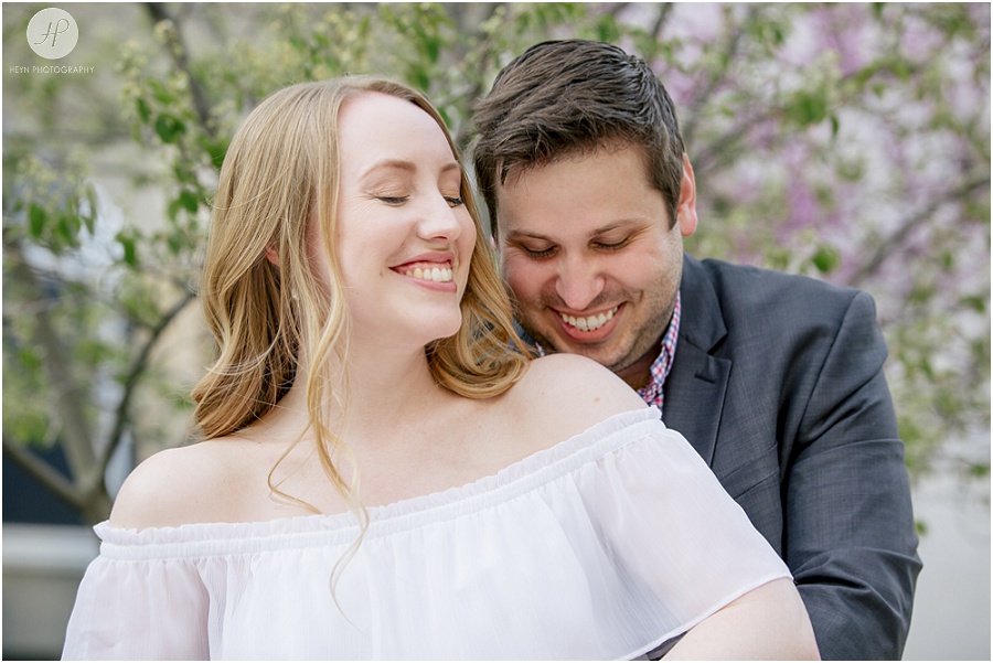couple laughing in garden at seton hall university engagement session