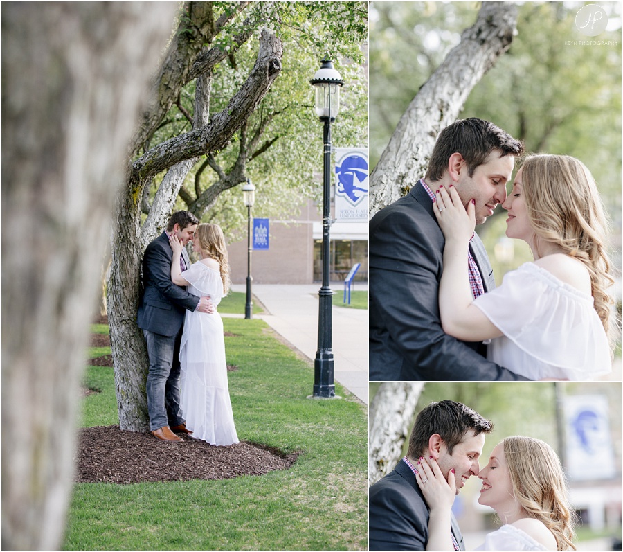 couple standing by tree at seton hall university engagement session