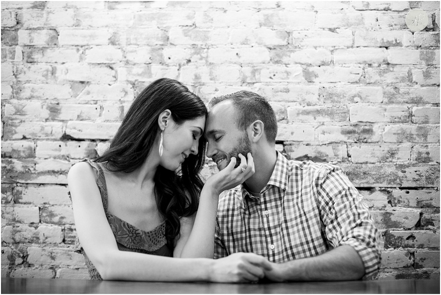 black and white of couple at restaurant in downtown Princeton university engagement session