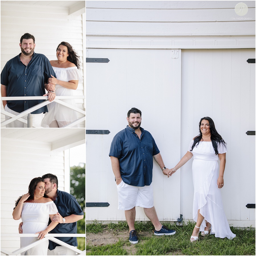 couple by light house at sandy hook engagement session