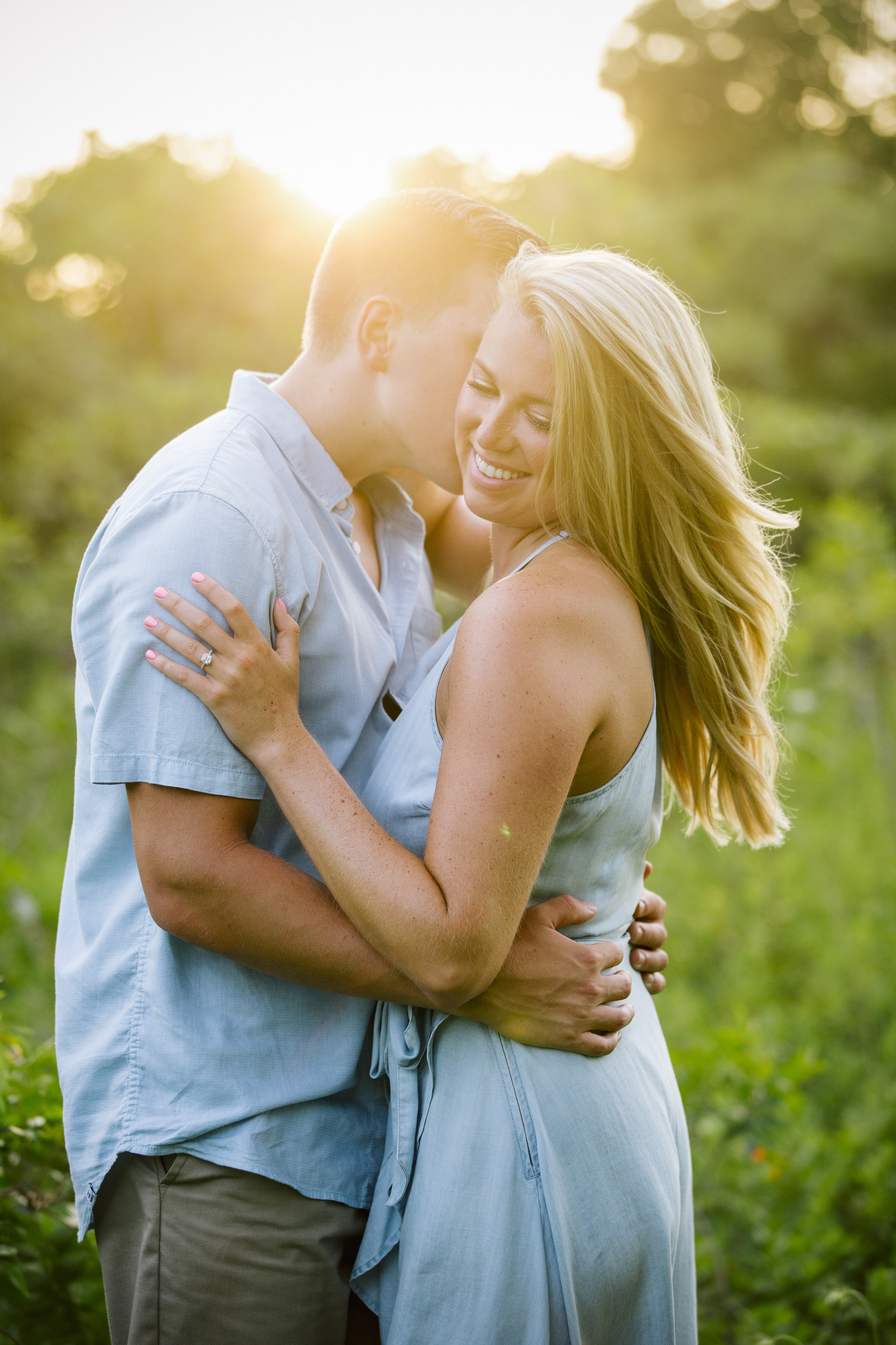 couple at sunset in tall grass on Manasquan engagement session