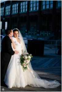 wedding photos of bride and groom outside convention hall in asbury park nj