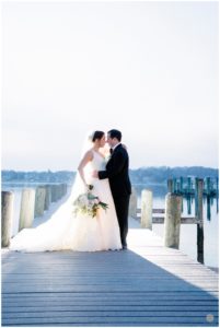 bride and groom outside clarks landing yacht club nj