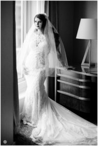dramatic black and white photo of bride getting ready
