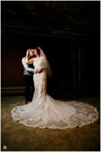 bride and groom dramatic photo at landmark loews jersey theatre wedding